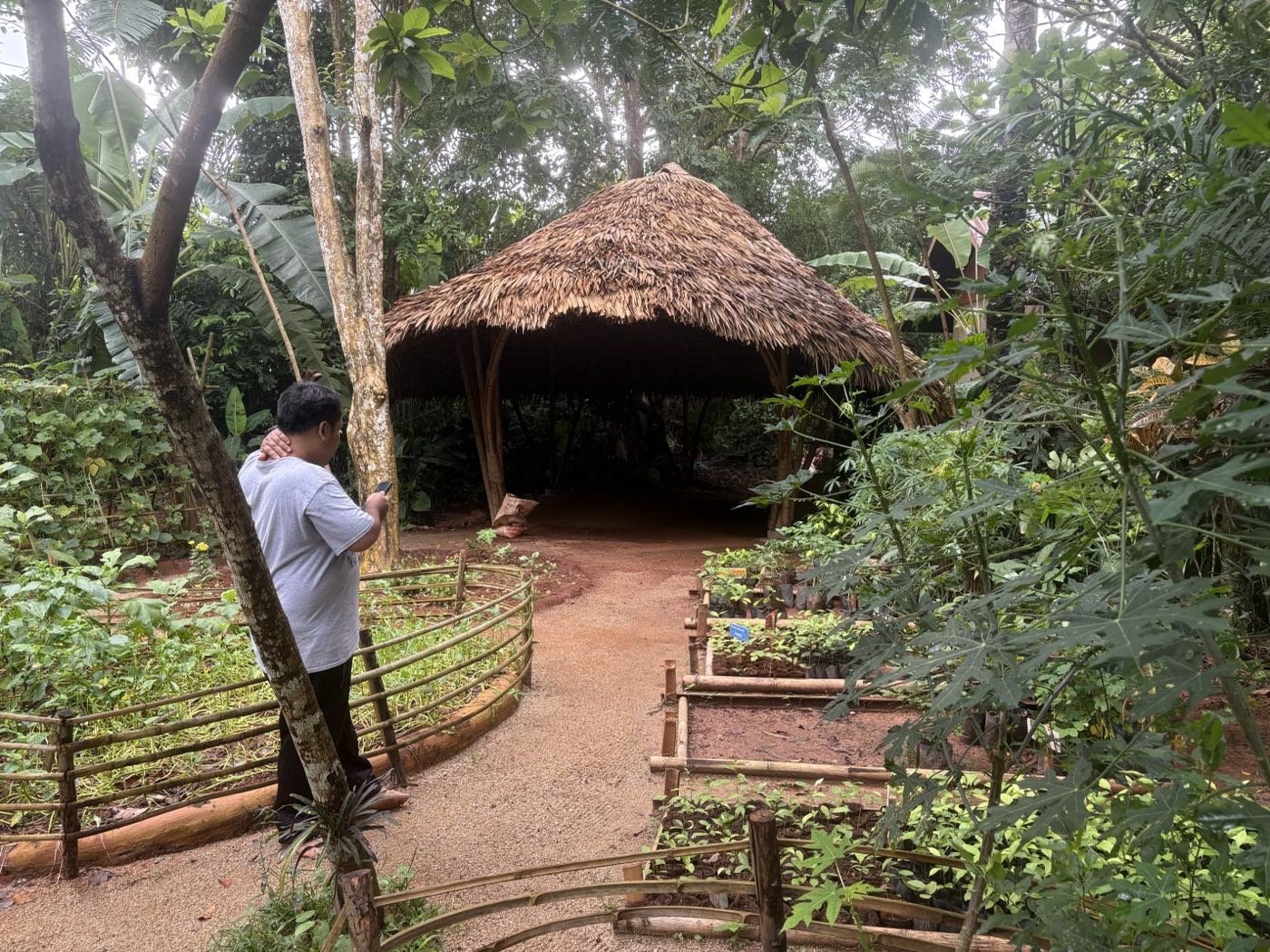 The thatched sala at the end of the garden path